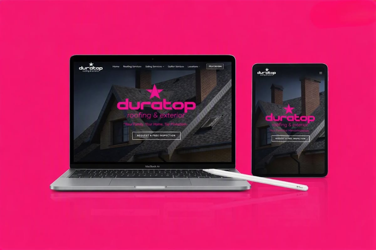 Laptop and mobile phone displaying a roofing website on a vibrant pink background with a stylus pen